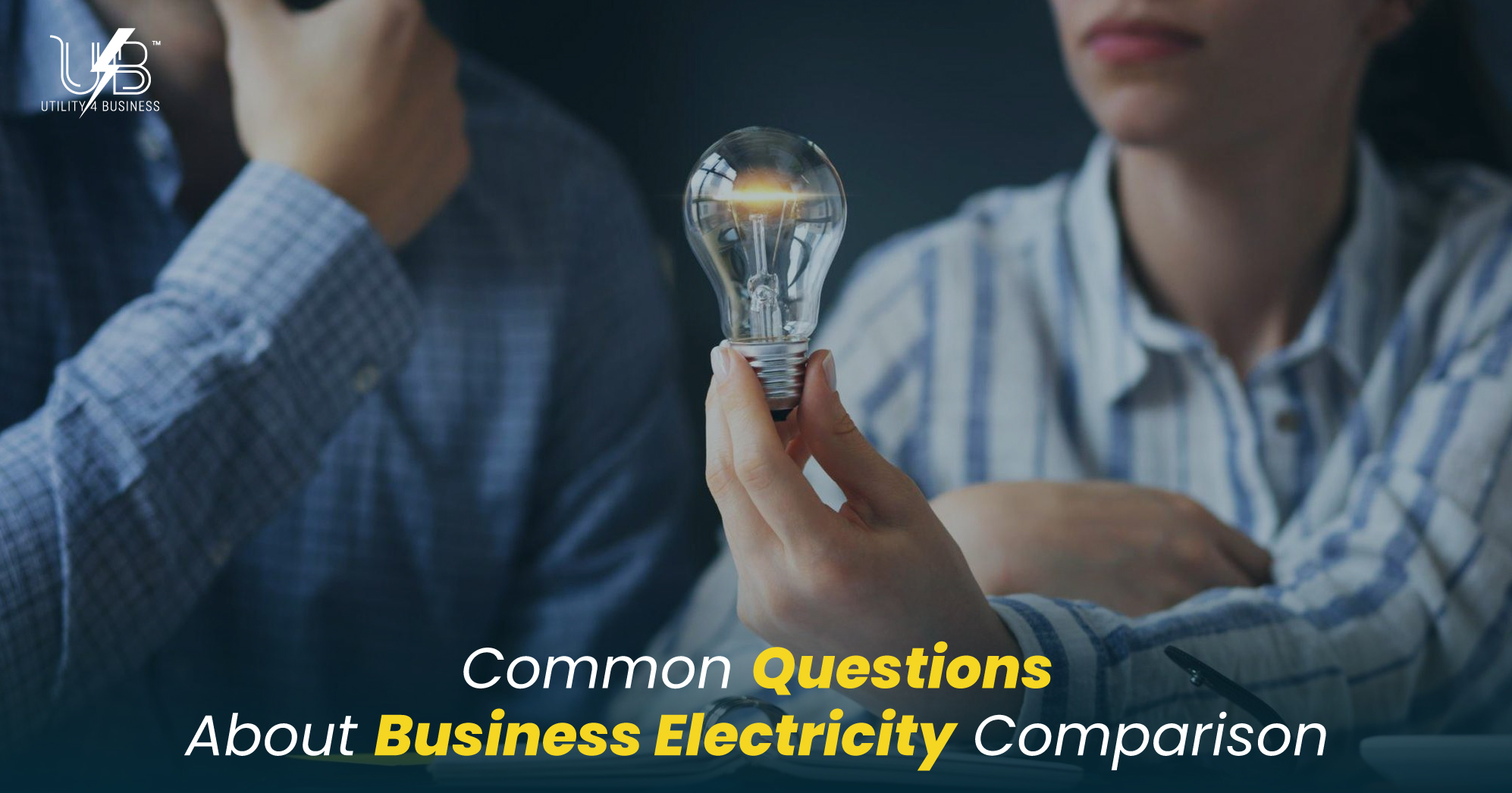 UK business electricity comparison, Utility4Business: compare rates, standing charges, VAT & CCL—lightbulb held in meeting
